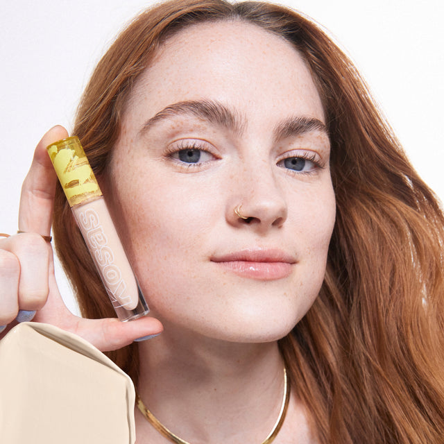 Model wearing Revealer Concealer in Tone 01 N