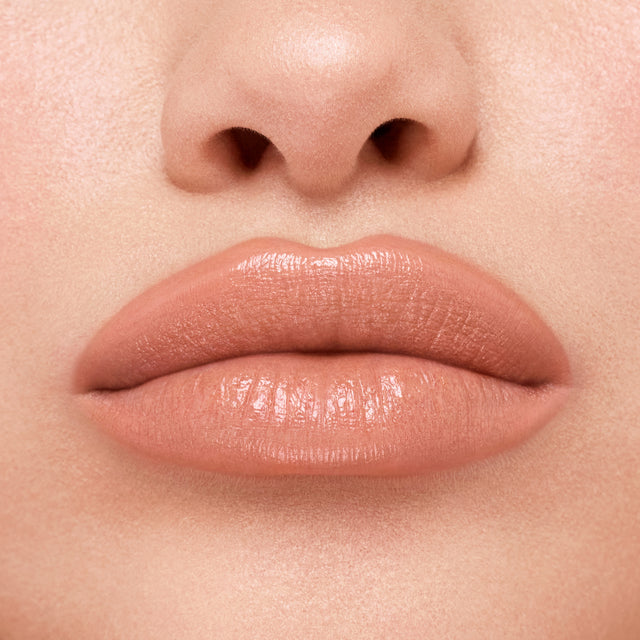 Light skin tone model wearing Weightless Lip Color in Sugar High