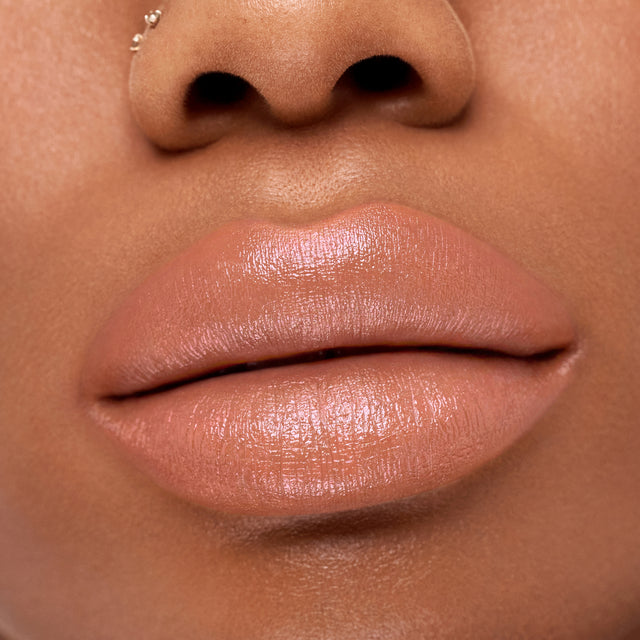 Deep skin tone model wearing Weightless Lip Color in Sugar High