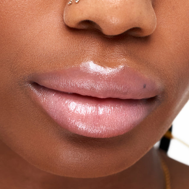 Deep skin tone model wearing Wet Stick in Baby Rose