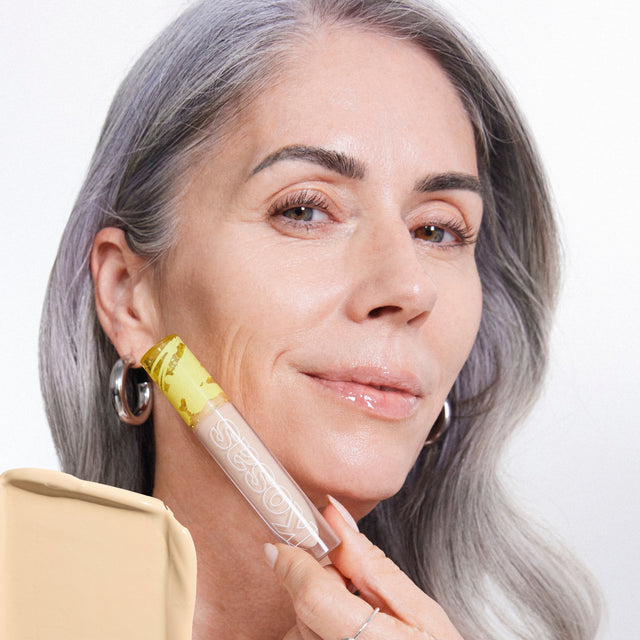 Model wearing Revealer Concealer in Tone 02 W