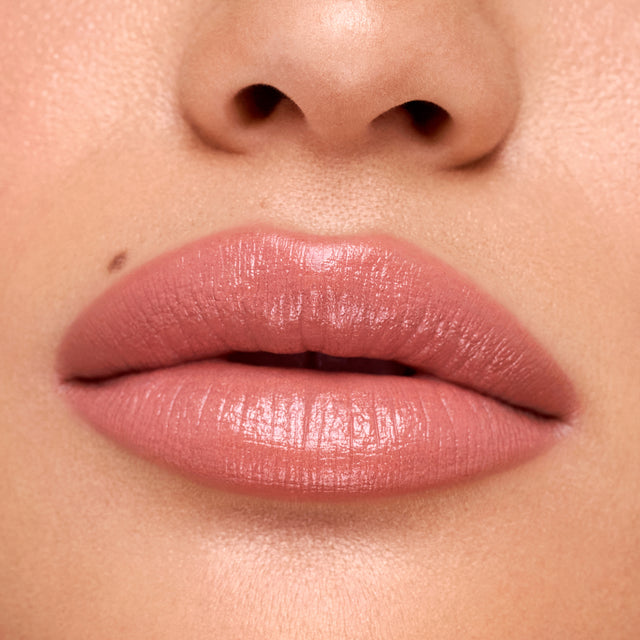 Medium skin tone model wearing Weightless Lip Color in High Cut