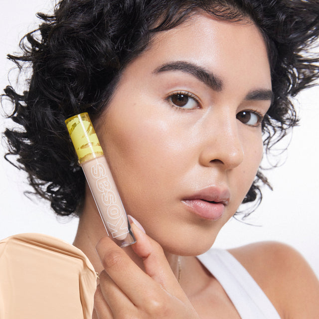 Model wearing Revealer Concealer in Tone 03 W