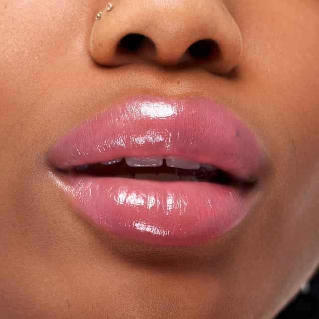 Deep skin tone model wearing Wet Stick in Malibu