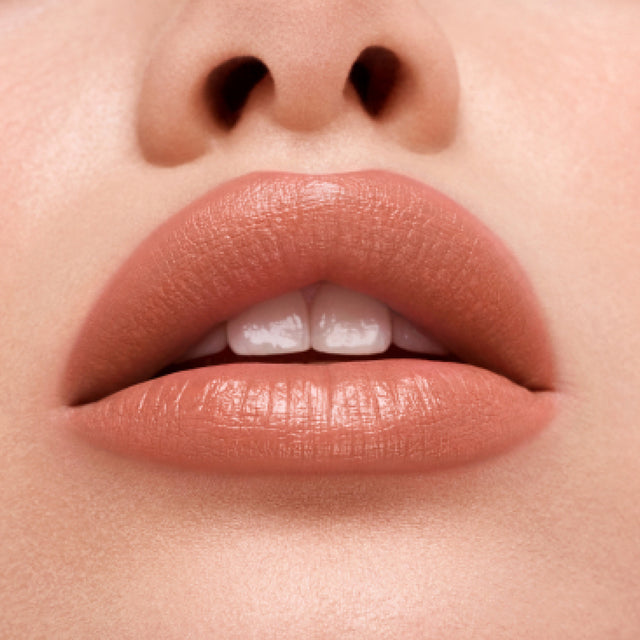 Light skin tone model wearing Weightless Lip Color in Vegas