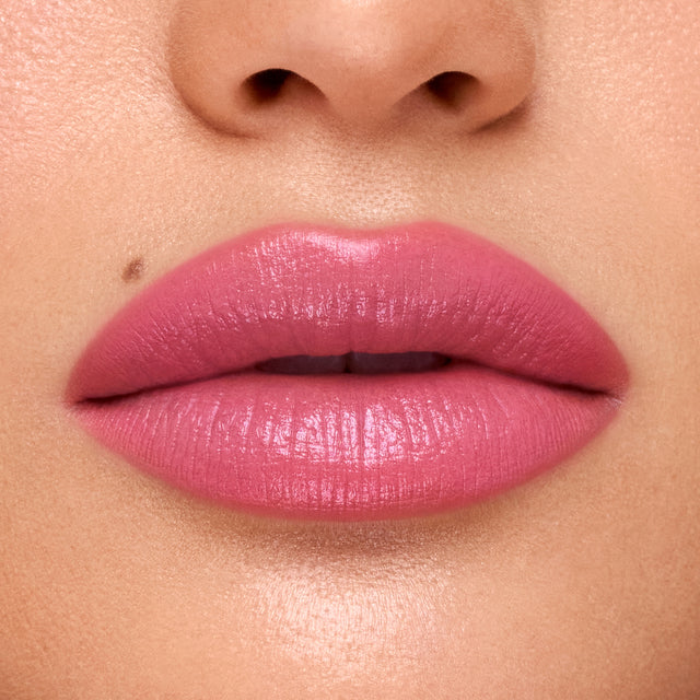 Medium skin tone model wearing Weightless Lip Color in Beach House