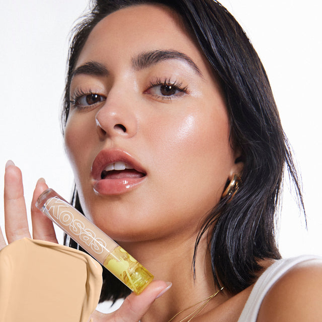 Model wearing Revealer Concealer in Tone 05 W