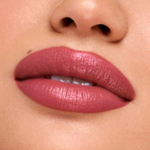 Medium skin tone model wearing Weightless Lip Color in Daydream