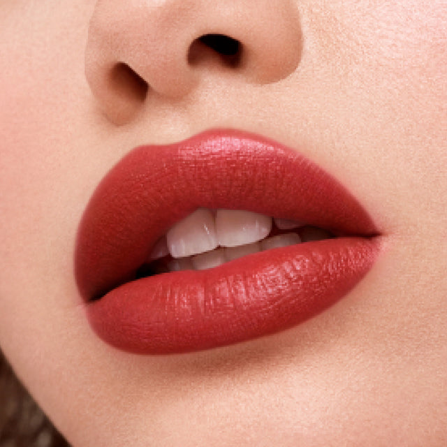 Light skin tone model wearing Weightless Lip Color in Deep Talks