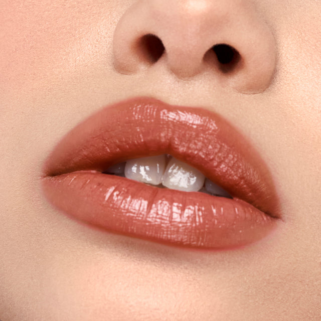 Light skin tone model wearing Wet Stick in Sunset Simmer