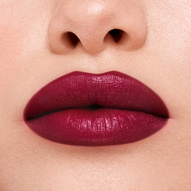Light skin tone model wearing Weightless Lip Color in Star Power