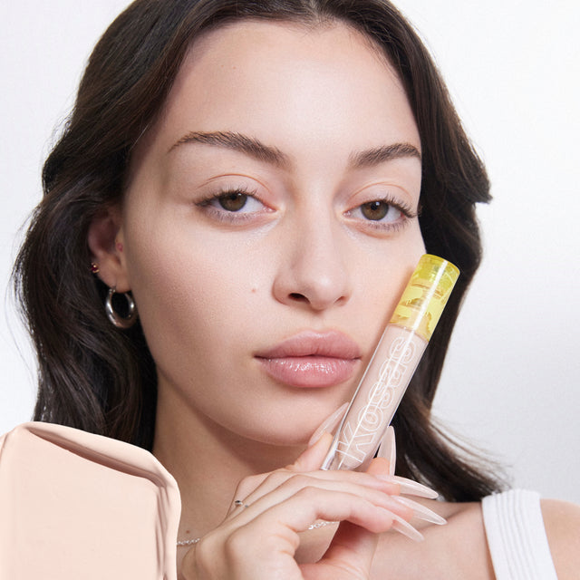 Model wearing Revealer Concealer in Tone 1.5 C