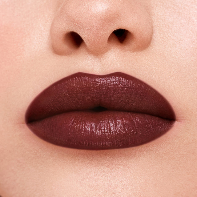 Light skin tone model wearing Weightless Lip Color in Subconscious