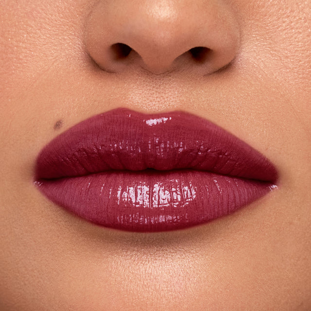 Medium skin tone model wearing Wet Stick in Bikini Blaze