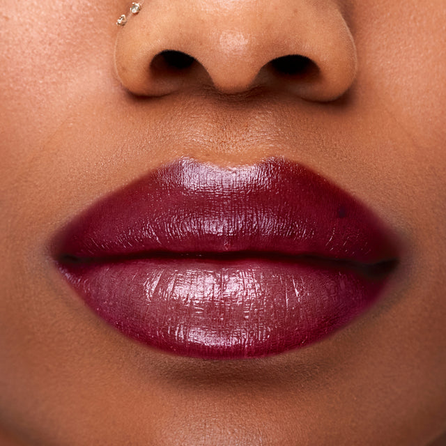 Deep skin tone model wearing Wet Stick in Bikini Blaze