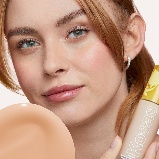 Model wearing Revealer Skin-Improving Foundation SPF 25 in Light Cool 150