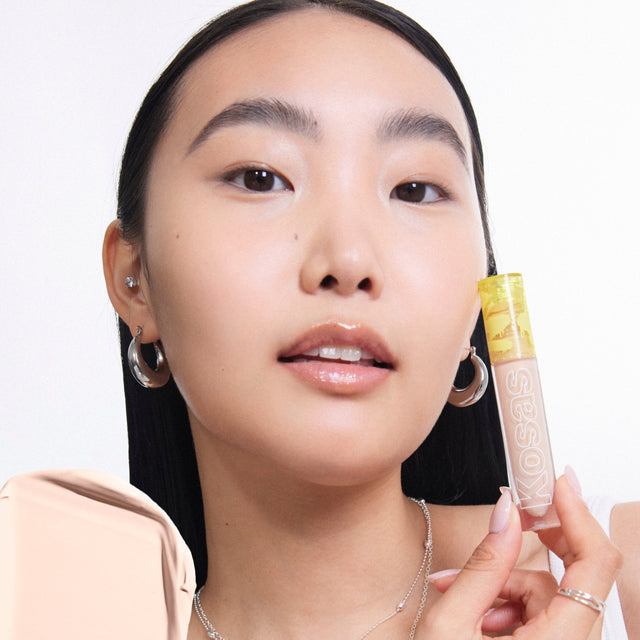 Model wearing Revealer Concealer in Tone 2.5 C
