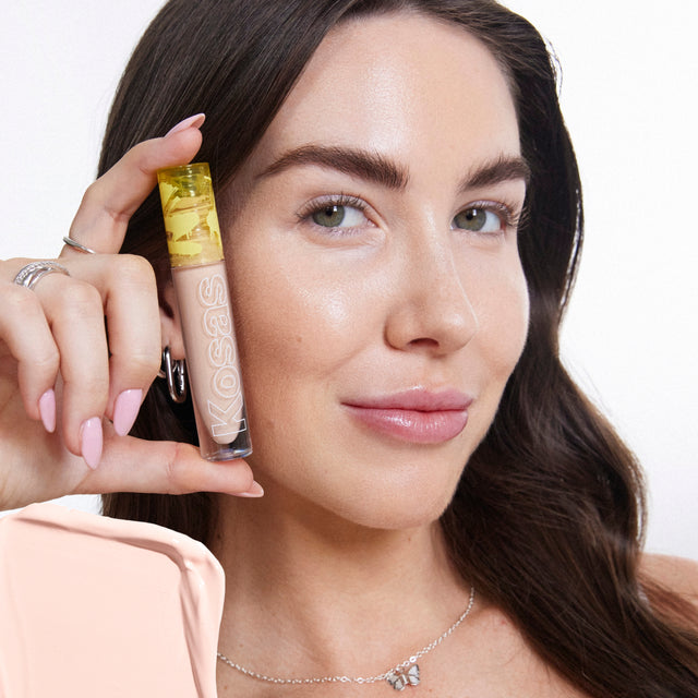 Model wearing Revealer Concealer in Tone 2.6 C