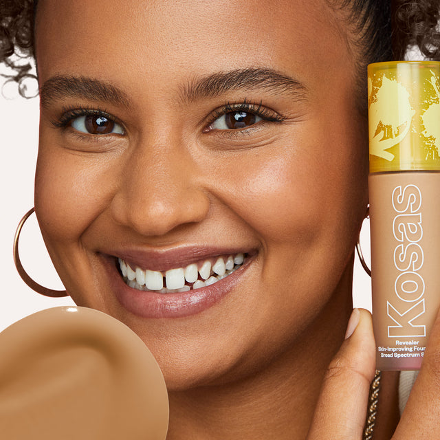 Model wearing Revealer Skin-Improving Foundation SPF 25 in Medium Deep Neutral Olive 290