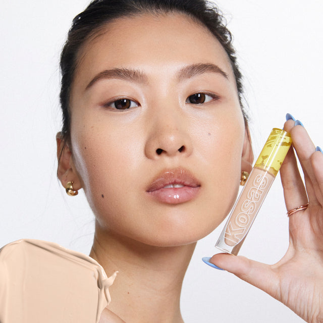 Model wearing Revealer Concealer in Tone 3.2 O