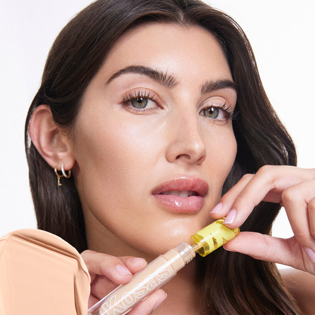 Model wearing Revealer Concealer in Tone 3.8 N