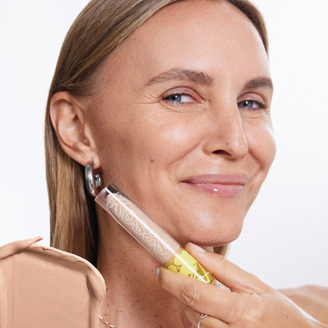 Model wearing Revealer Concealer in Tone 5.3 C