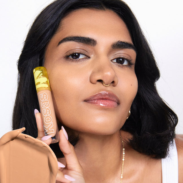 Model wearing Revealer Concealer in Tone 6.2 N