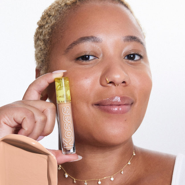Model wearing Revealer Concealer in Tone 6.3 N