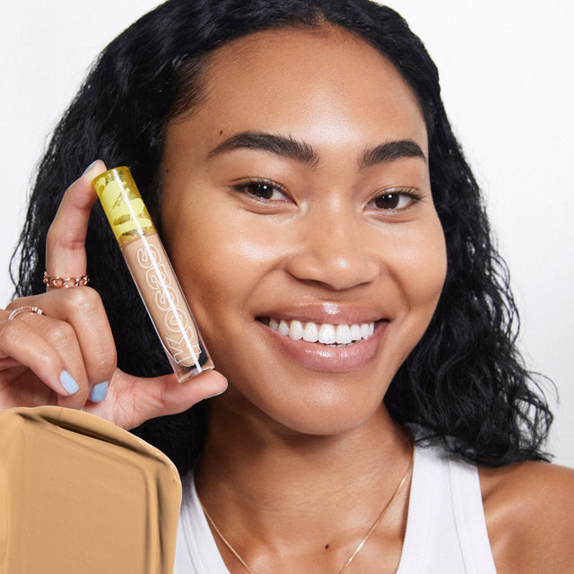 Model wearing Revealer Concealer in Tone 6.5 O