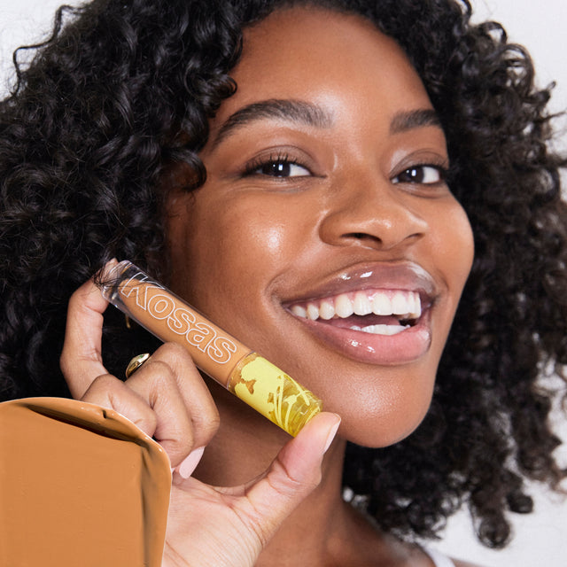 Model wearing Revealer Concealer in Tone 7.5 W