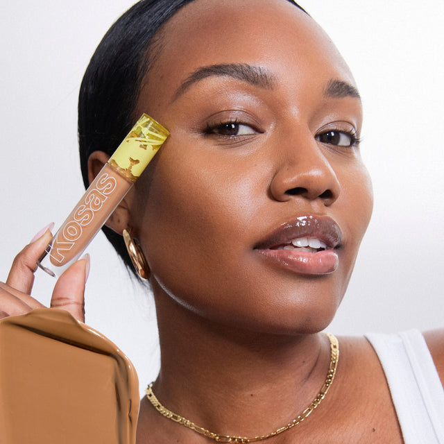 Model wearing Revealer Concealer in Tone 7.8 N