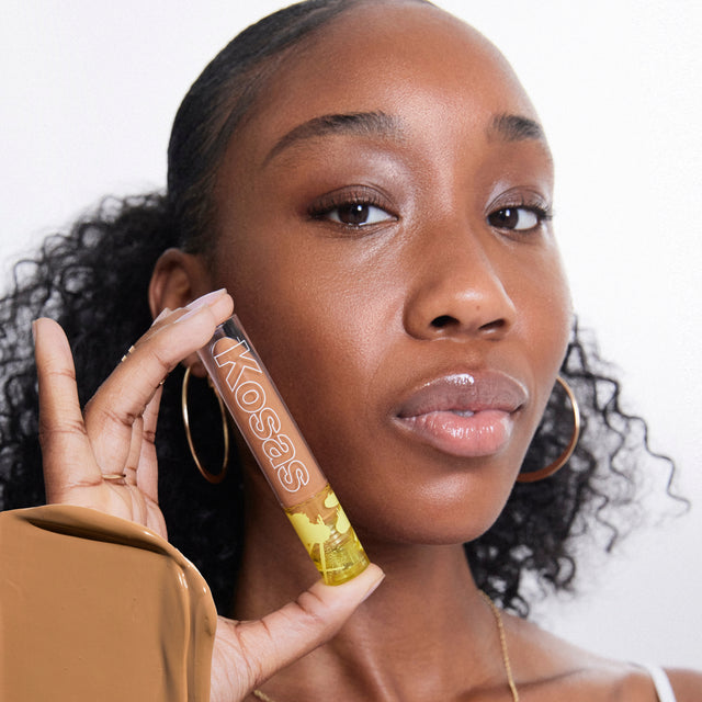 Model wearing Revealer Concealer in Tone 8.1 O