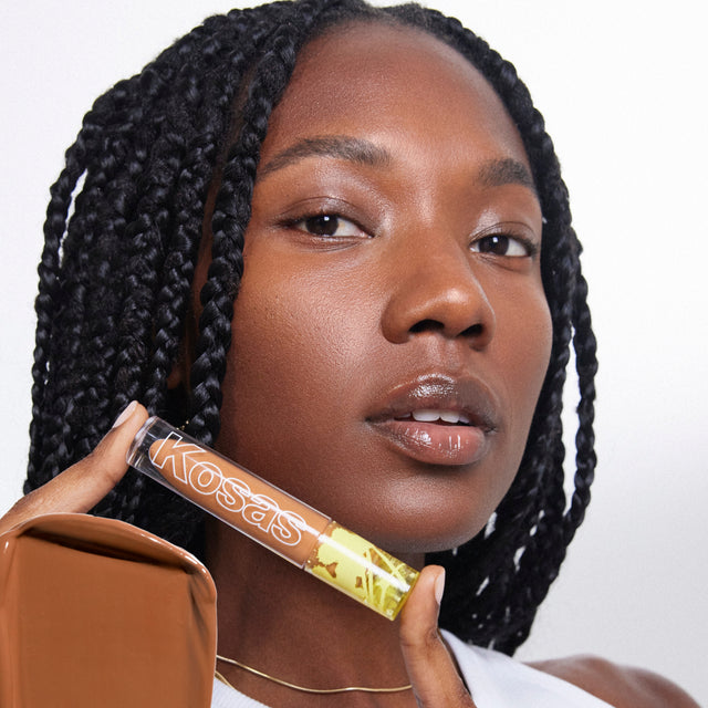 Model wearing Revealer Concealer in Tone 8.2 W