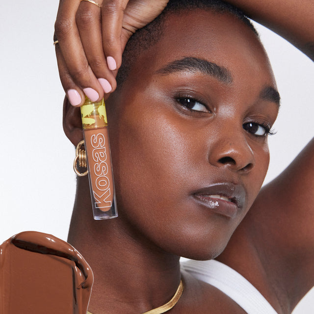 Model wearing Revealer Concealer in Tone 8.7 N