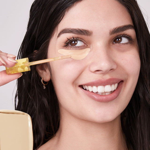 Model wearing Mini Revealer Concealer in Tone 04 N