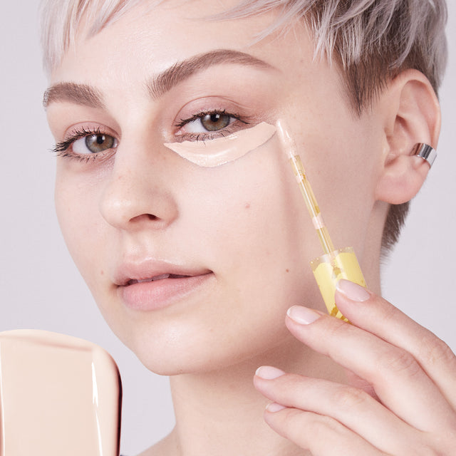 Model wearing Mini Revealer Concealer in Tone 1.5 C