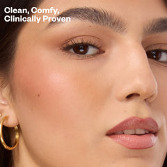 Close-up of a woman's face with text 'Clean, Comfy, Clinically Proven'