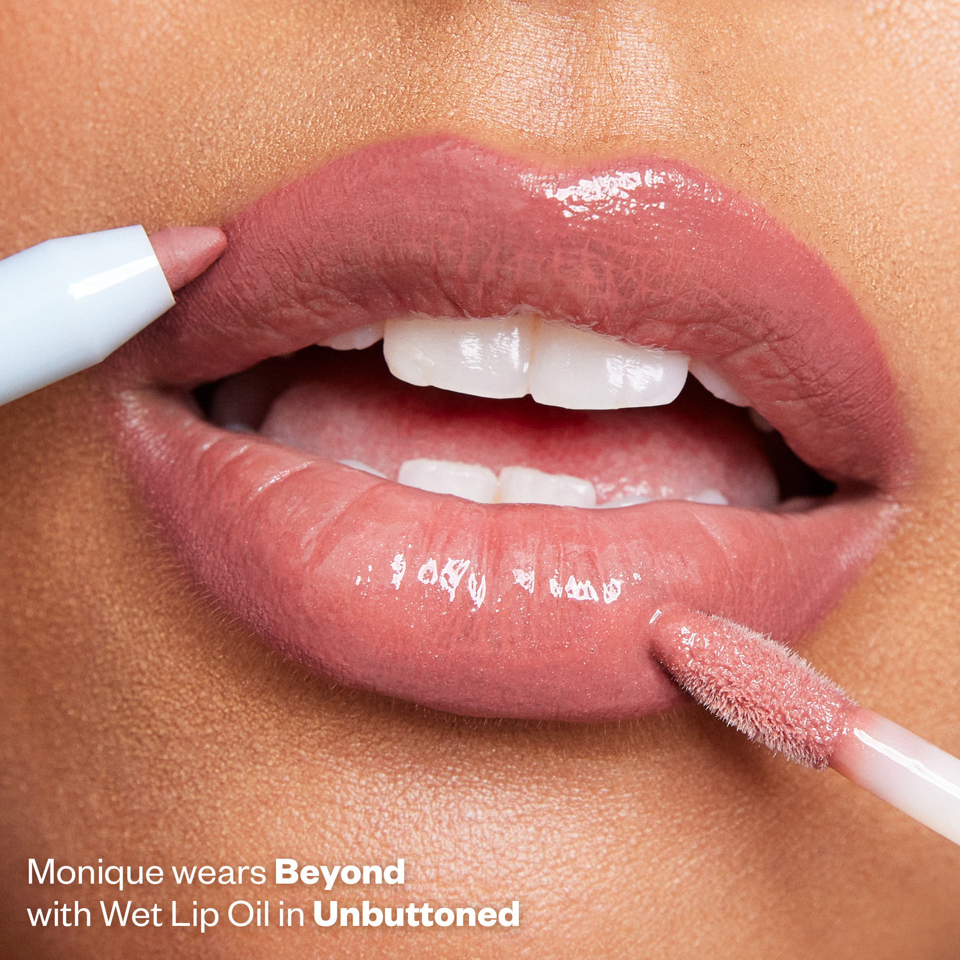Monique wears Beyond in Wet Lip Oil in Unbuttoned