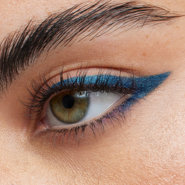 Green eye model wearing Soulgazer in Cosmic