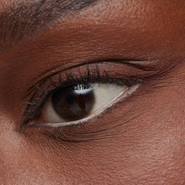 Deep skin tone model wearing Soulgazer in Gravitate