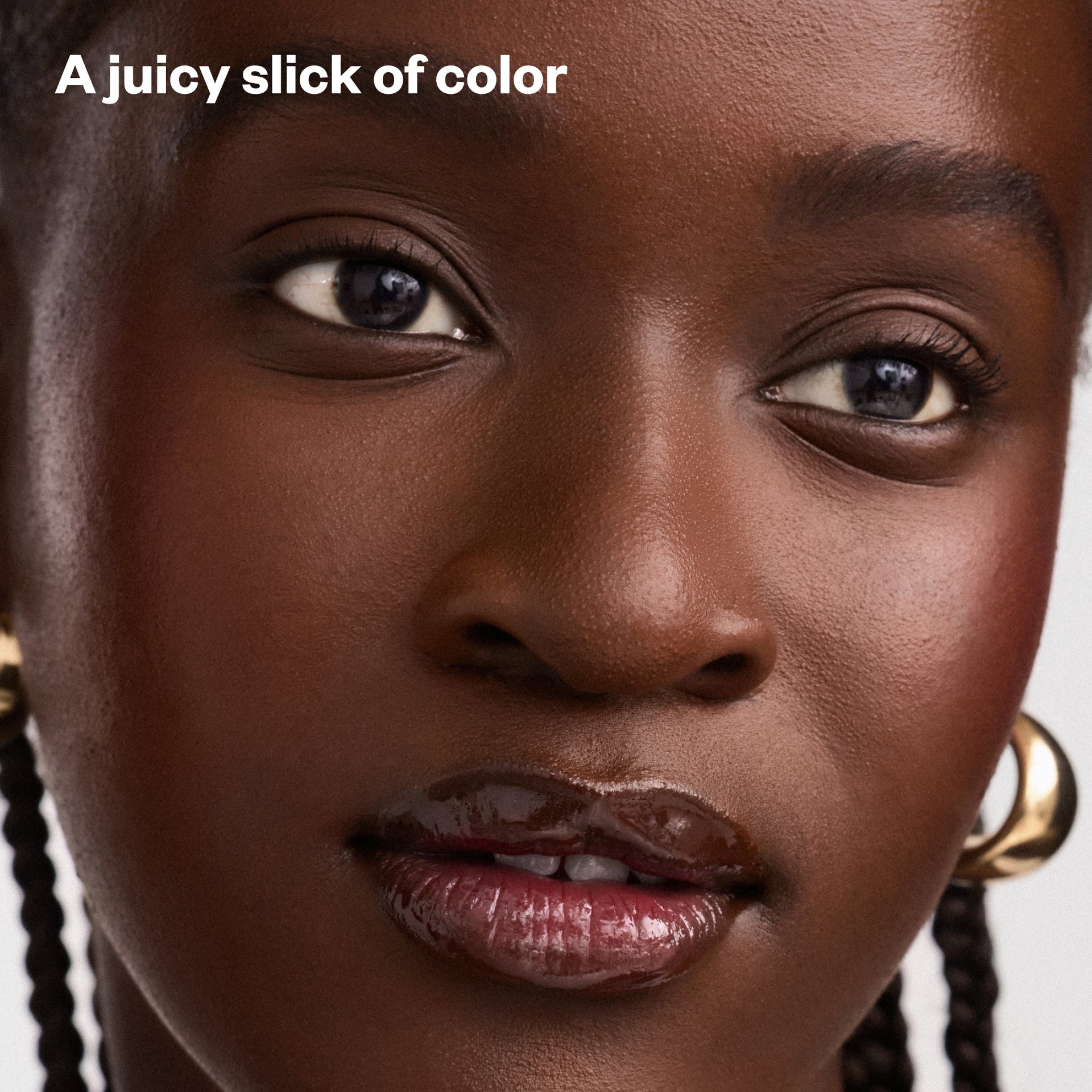 A juicy slick of color - Wet Lip Oil in Cola on Model's Lips